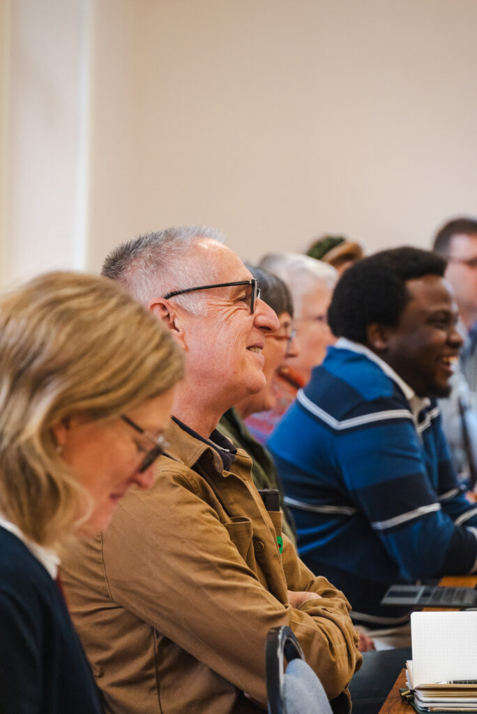 SEI students in an in-person class smiling