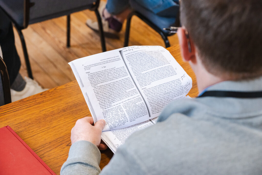 SEI student in class with annotated reading