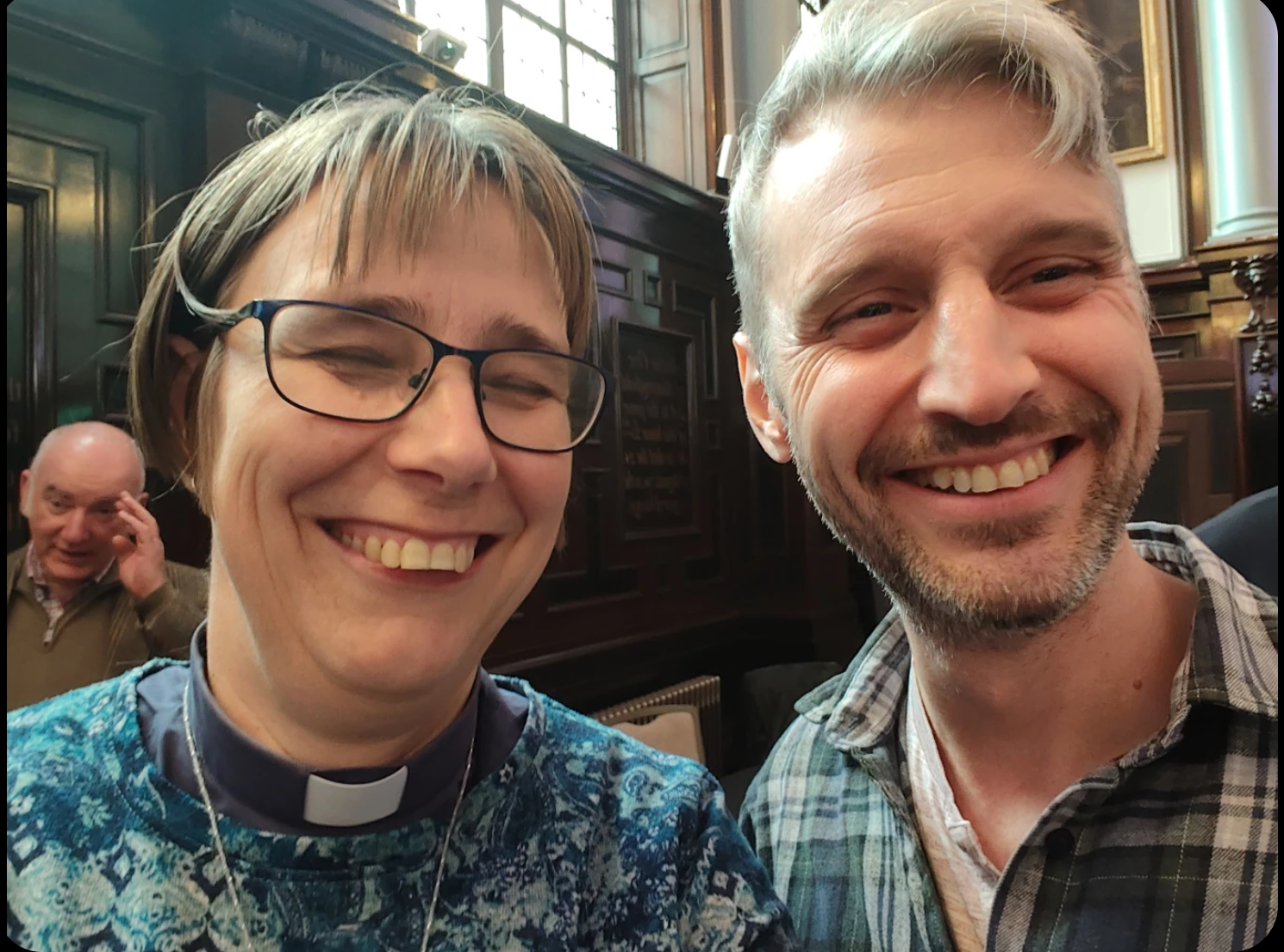 Two people's smiling faces fill the screen. On the left is Rev Dr Anna-Claar Thomasson-Rosingh, on the right is David Benjamin Blower.